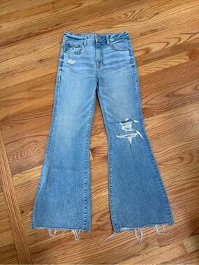 Light Blue Distressed Flare Jeans - Women's